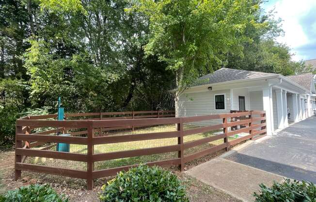 a wooden fence in front of a house