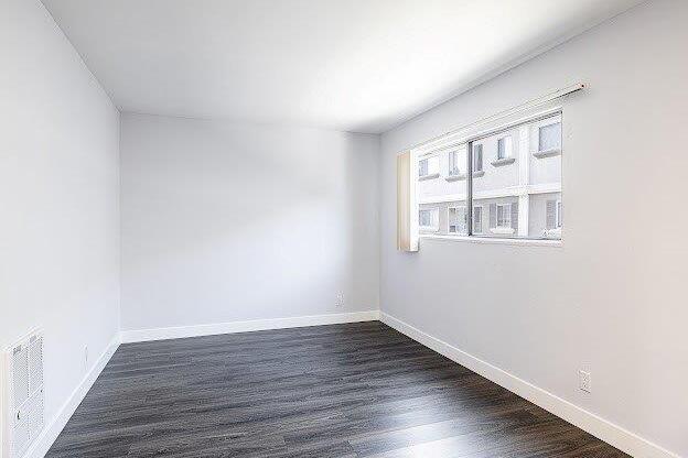 A room with a window and a radiator on the wall.