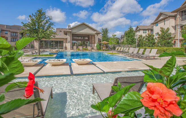 pool with flowers at Ovation at Lewisville Apartments, Lewisville, Texas