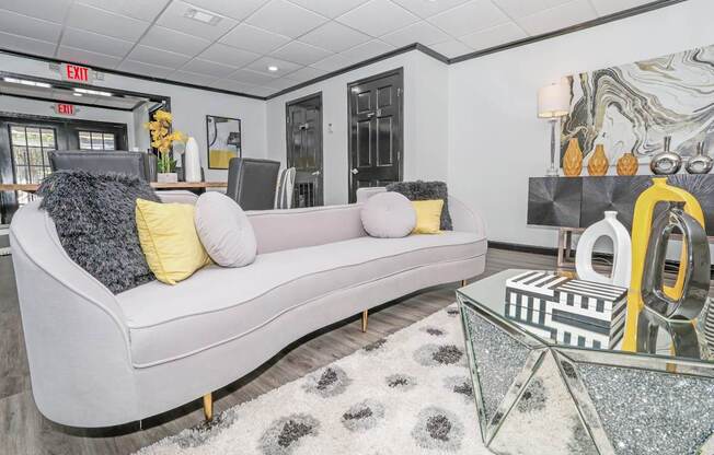 Comfy couch in clubhouse lounge area at Maplewood apartments in Shreveport, LA.