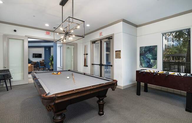 Pool table in game room - Monterra Las Colinas Apartments