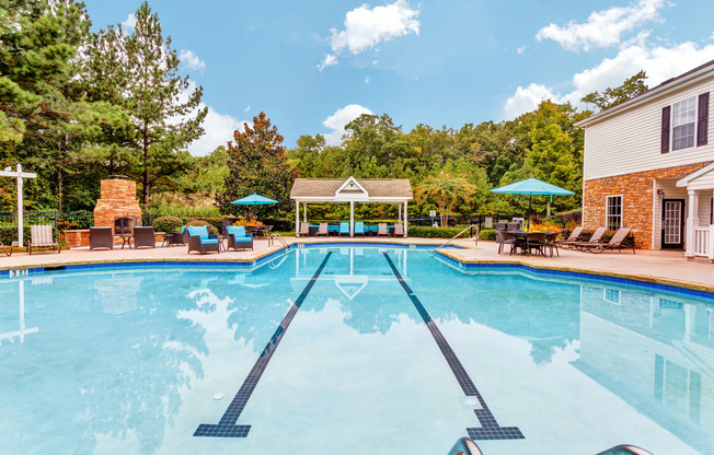 View of Pool Area, Showing Fenced-In Area, Cabana, and Picnic Areas at Summer Park Apartments