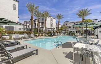 Dive into luxury living at Michael B Apartments, where every day feels like a vacation with our resort-style pool and inviting lounge area.at The Michael B Townhomes and Flats, Nevada