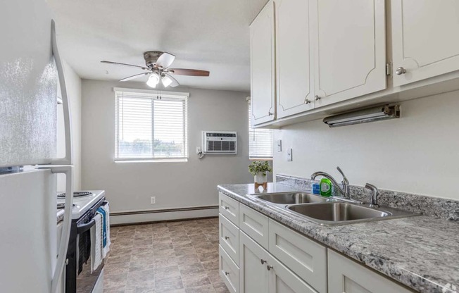 a kitchen with granite counter tops and a sink