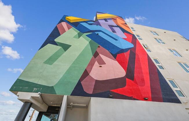 A large, colorful mural on the side of a building.