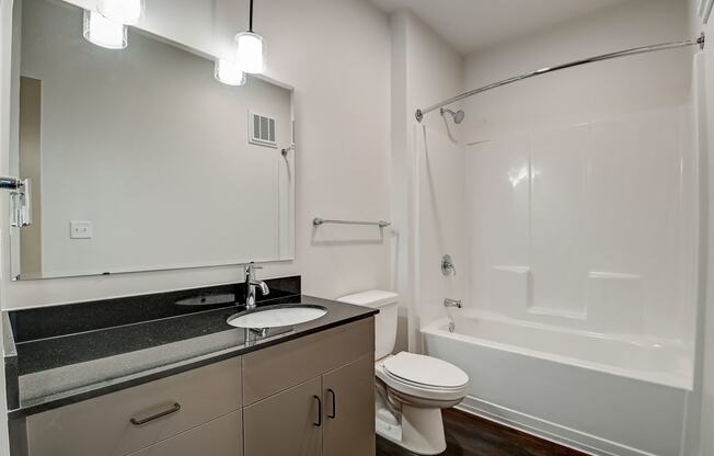 a bathroom with a sink toilet and bathtub