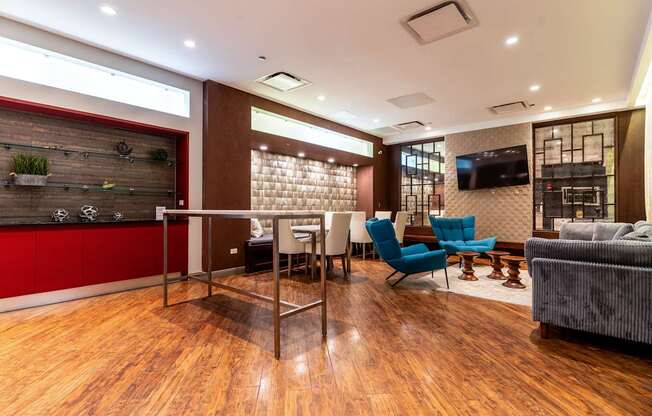 a conference room with a table and chairs and a television