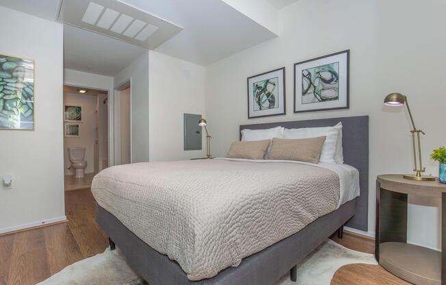 a bedroom with a bed and a mirror