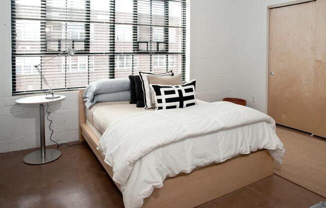 bedroom with tall ceilings and large windows