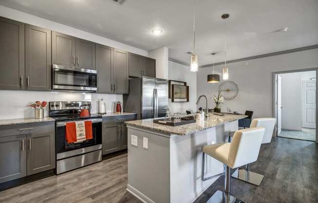 a kitchen with stainless steel appliances and a counter top