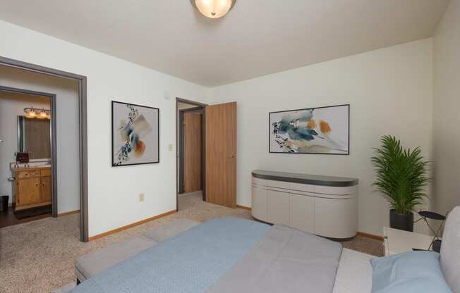 Fargo, ND Park Circle Apartments.  a bedroom with a bed and a bathtub