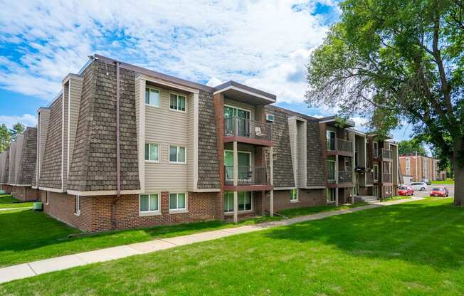 our apartments offer a spacious living area and a green lawn