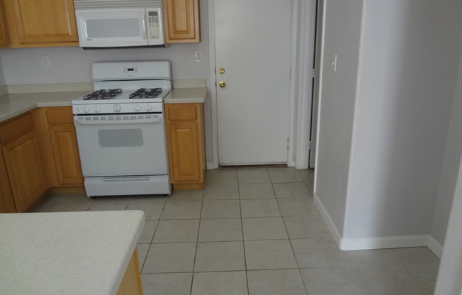 THIS 1,596 SQ. FT. HOME HAS 3 BEDROOMS, 2.5 BATHROOMS, A 2 CAR GARAGE LOCATED ON A CORNER LOT AND NEW WOOD FLOORING