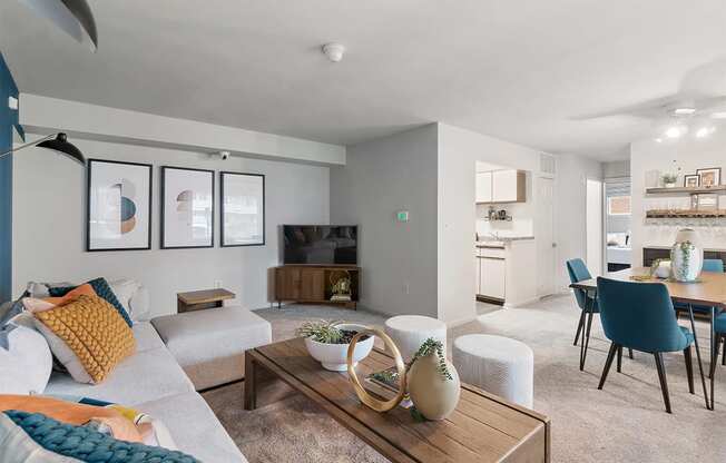 a living room and dining room with a couch and a table