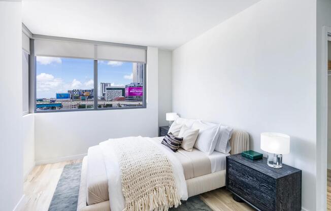 Serene bedroom retreat at Modera Riverside with soft finishes and sweeping Miami views.