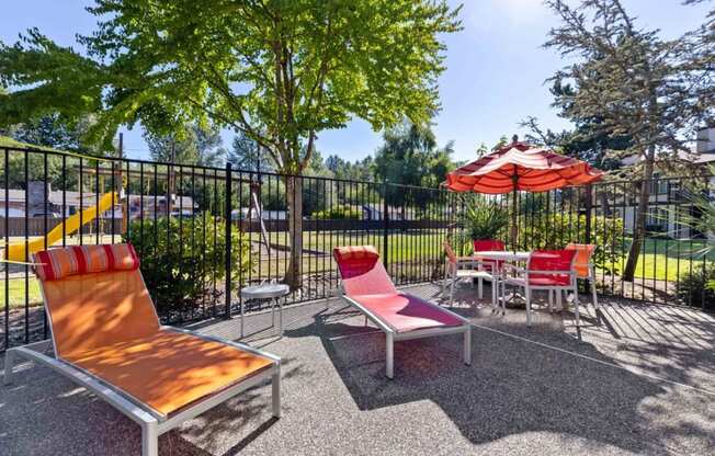 Saratoga Apartments in Everett, Washington Patio with Lounge Chairs