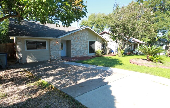 Southeast Austin Home with Vaulted Ceilings, Bonus Room & Private Backyard