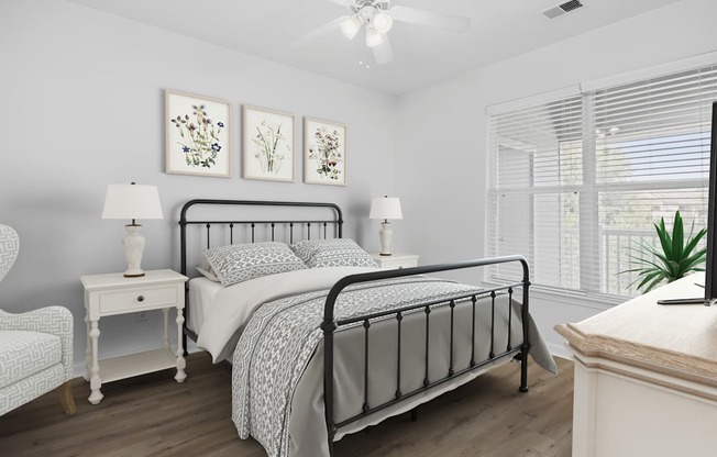 A bedroom with a large bed, a chair, a nightstand, and a painting on the wall.