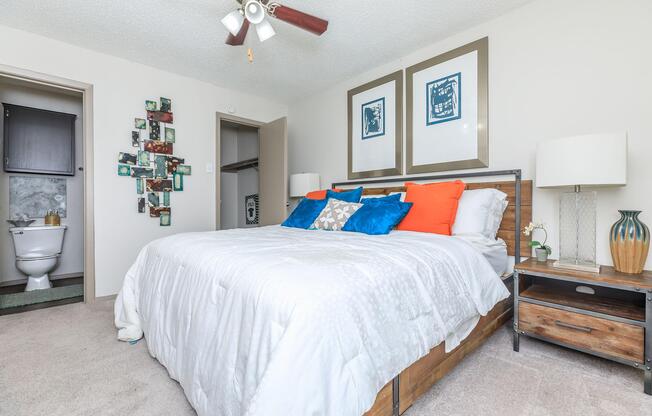 furnished bedroom with a white comforter