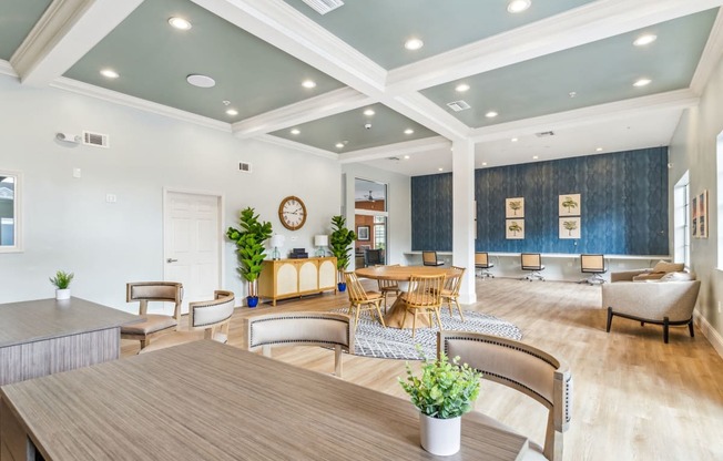 a living room with a table and chairs at Reserve at Temple Terrace, Temple Terrace