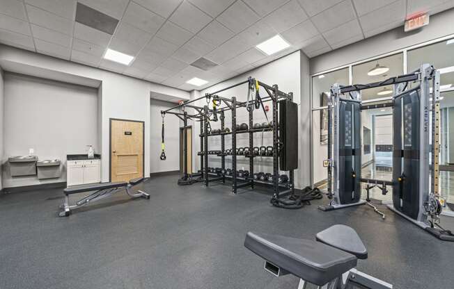 a fully equipped fitness room with free weights and other equipment  at The Icon, Richmond