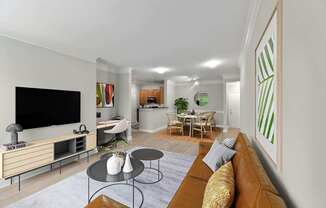 A living room with a brown couch and a television.