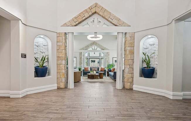 Clubhouse great room with lounge seating - Grand Centennial Apartments