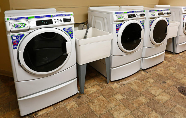 a row of washing machines in a laundromat
