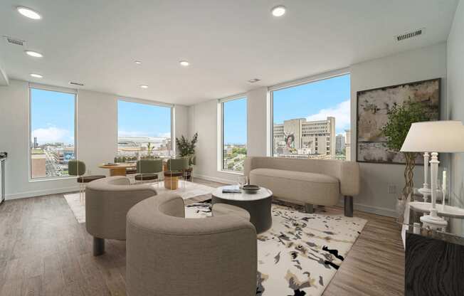 a living room with couches and chairs and a view of the city