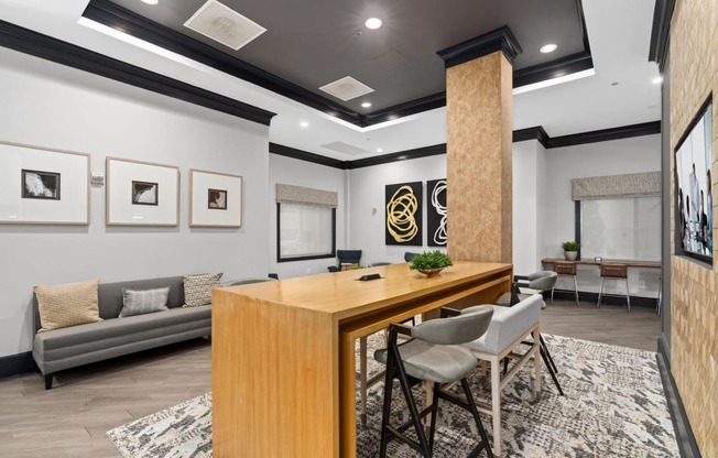 a conference room with a wooden desk and chairs