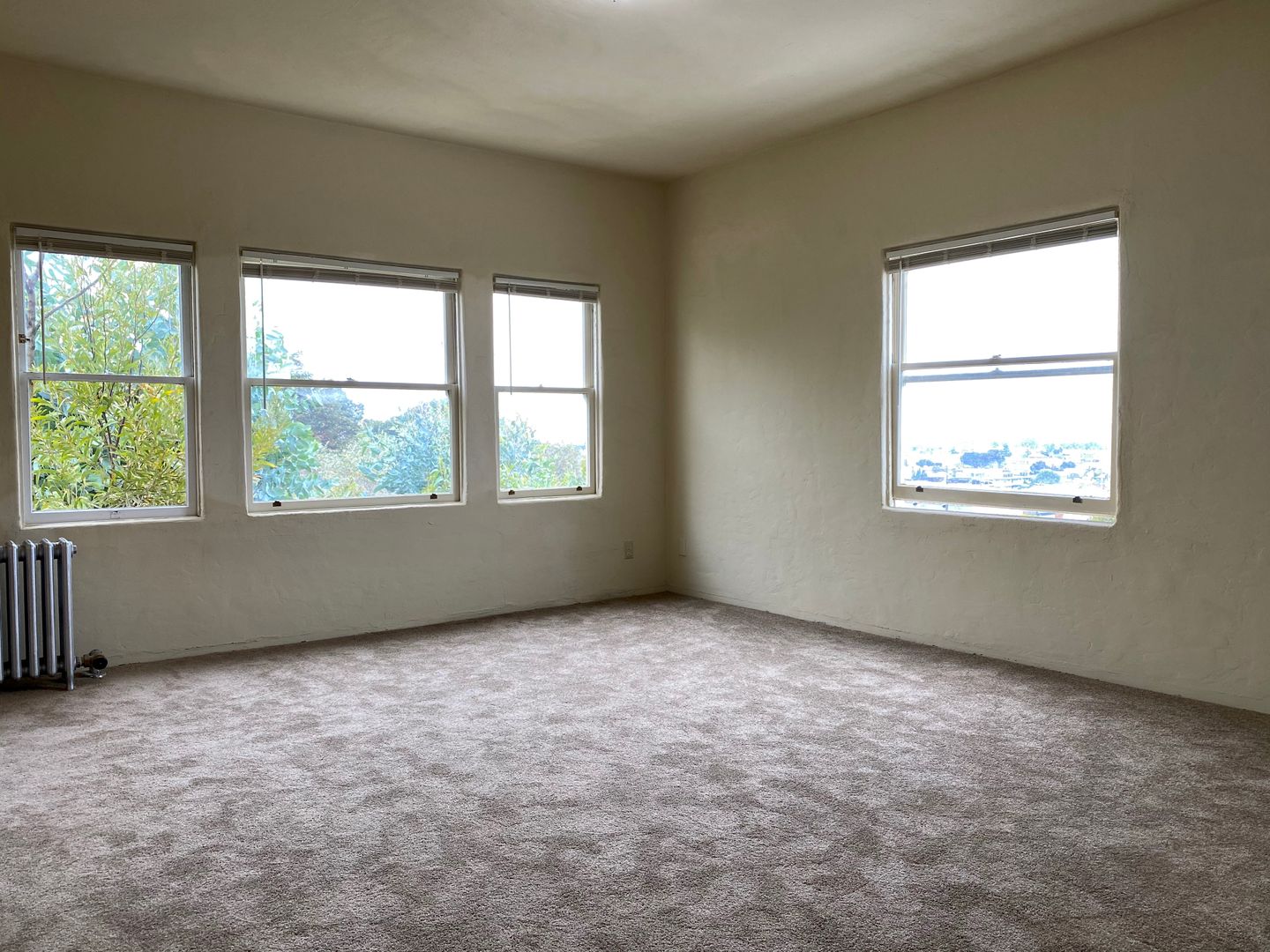 TOP FLOOR! Corner Unit w/ On-Site Laundry & Parking Available!