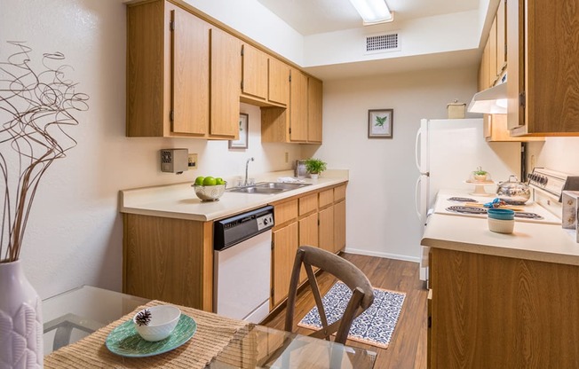 Cantera spacious kitchen with plenty of cabinetry and wood flooring