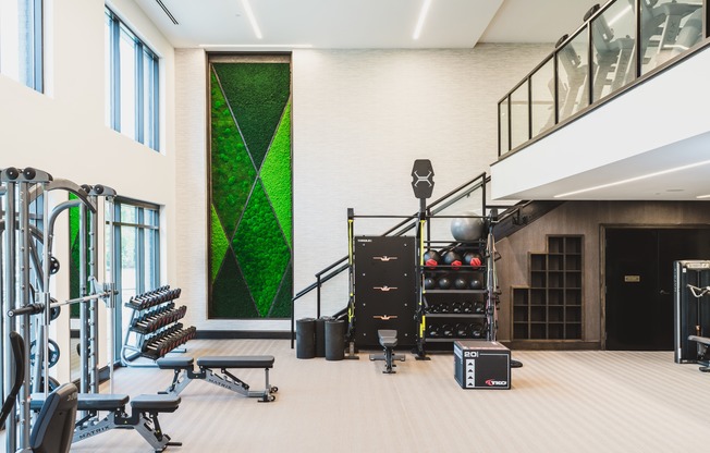 Two-story fitness studio with TRX station