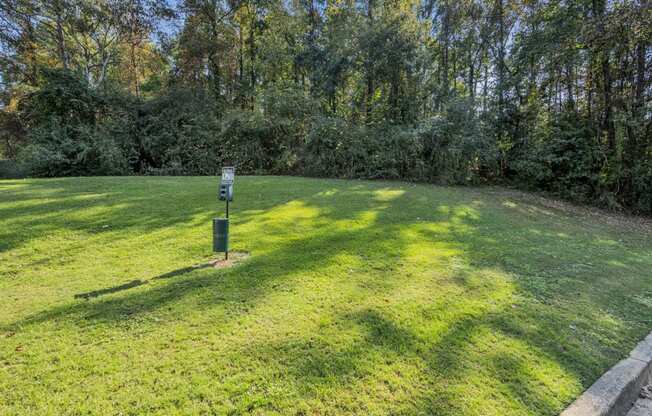 a lawn with a sign in the middle of it