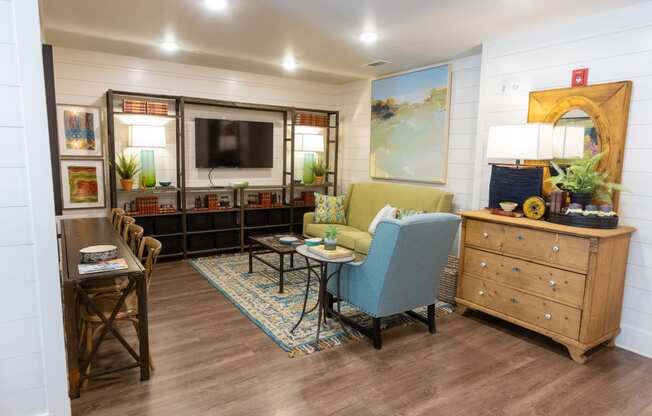 a living room filled with furniture and a flat screen tv