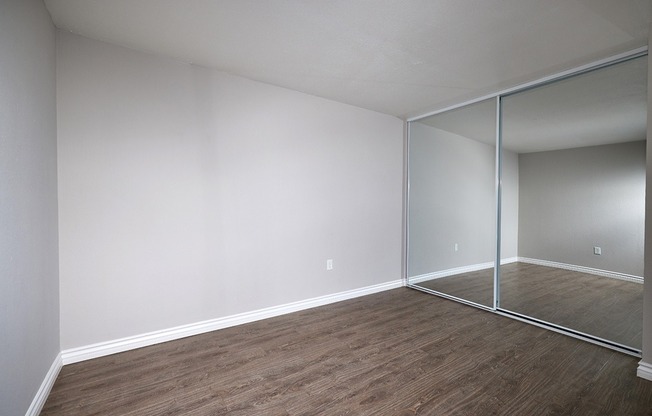 two bedroom bedroom with plank flooring