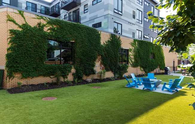 A building with a green vine on the side.