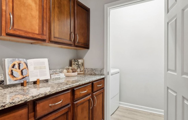 kitchen and laundry closet at Sorelle apartments