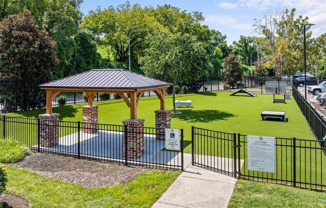 a park with a picnic area and a gazebo