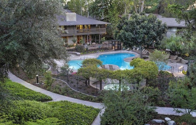 an aerial view of the clubhouse with a swimming pool