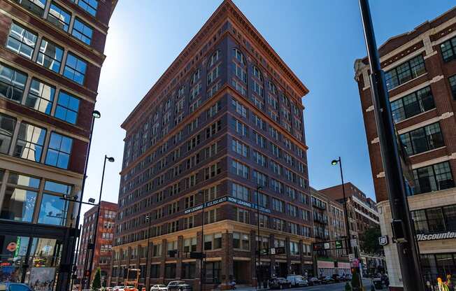a tall brick building on a city street