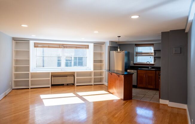 Bright and Peaceful One-Bedroom with Built-Ins and Rooftop Views