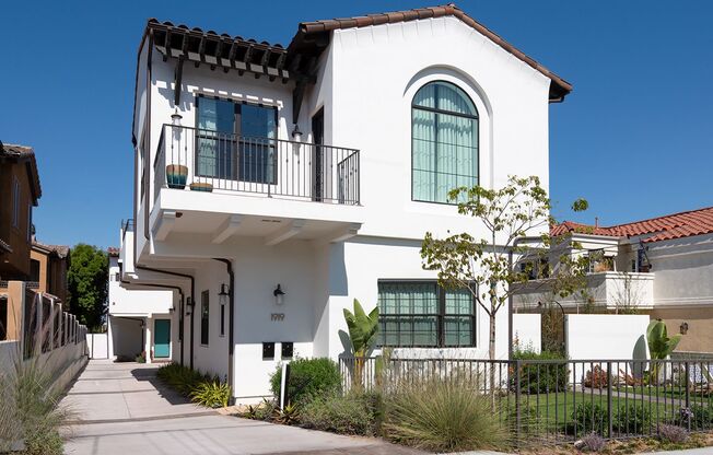 Upscale & Spacious, Spanish Style Tri-Level Townhome w/ Amazing Great Room Living Space, Rooftop Deck, 2 Balconies, Rear Yard & 2-Car Garage Close to Schools, Shopping & Just 2 Blocks to MB Border & 5 Mins to Beach!