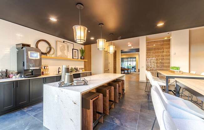 A modern clubhouse with a long island in the middle.