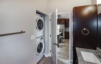 a bathroom with a washer and dryer