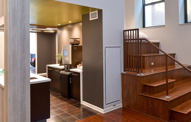 a view of the kitchen and stairs to the second floor