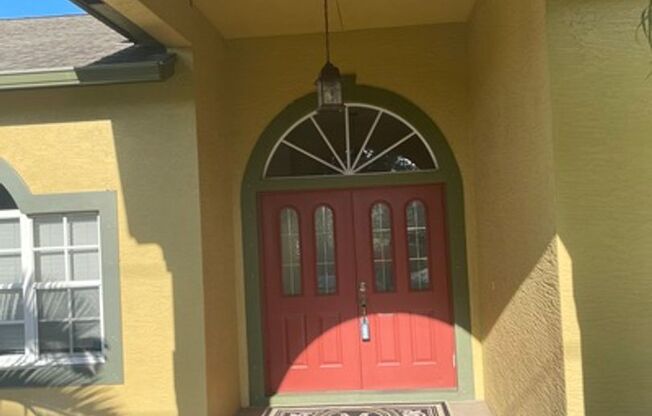 Well maintained large 4/2/2 corner lot pool home on a canal