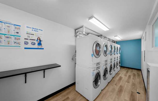 A row of washing machines in a laundromat.