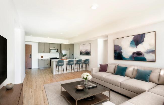 Open-concept floor plans feature oversized kitchen islands with bar seating, contemporary cabinetry, stainless steel appliances, and expansive living spaces designed for everyday comfort and entertaining.