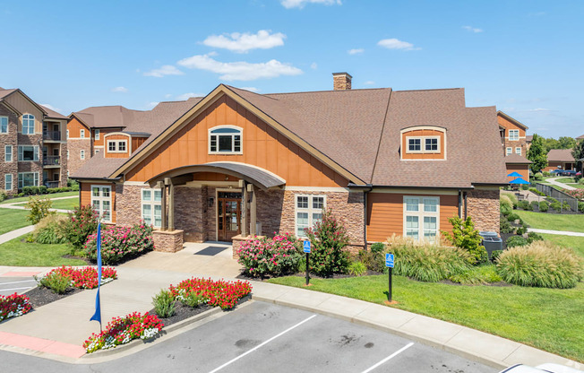 a house with a sidewalk in front of a parking lot